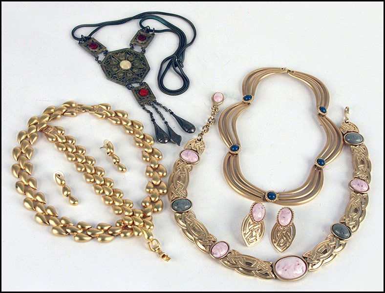 GIVENCHY BRUSHED GOLD TONE PARURE.: GIVENCHY BRUSHED GOLD TONE PARURE. Comprised of a necklace, bracelet, and pair of earrings. Together with a Monet gold tone knot necklace with matching earrings, a Hattie Carnegie necklace, and a Mone