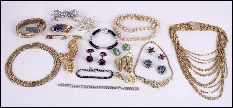 TRIFARI GILT STERLING SILVER CLIP / BROOCH.: TRIFARI GILT STERLING SILVER CLIP / BROOCH. Bearing a large blue rhinestone. Together with a Sarah Coventry starburst rhinestone brooch, a Trifari necklace, a Sarah Coventry gold tone necklace, two st