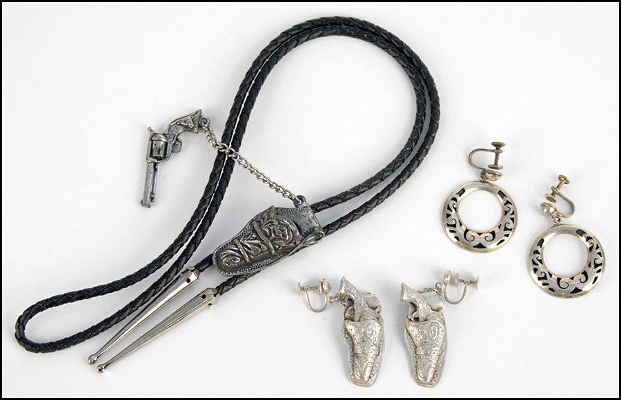 PAIR OF STERLING SILVER REVOLVER AND HOLSTER SCREWBACK : PAIR OF STERLING SILVER REVOLVER AND HOLSTER SCREWBACK EARRINGS. Together with a gun in holster form bolo, and a pair of sterling silver circular screwback earrings