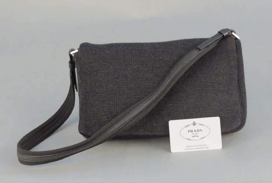 PRADA BLACK WOOL AND LEATHER HANDBAG.: PRADA BLACK WOOL AND LEATHER HANDBAG. With a Prada authenication card, and dustbag H: 6" W: 12" D: 2.5"