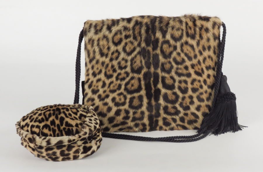 LEOPARD AND BLACK VELVET MUFF.: LEOPARD AND BLACK VELVET MUFF. Together with a leopard fur pillbox hat Muff: 12" x 14"