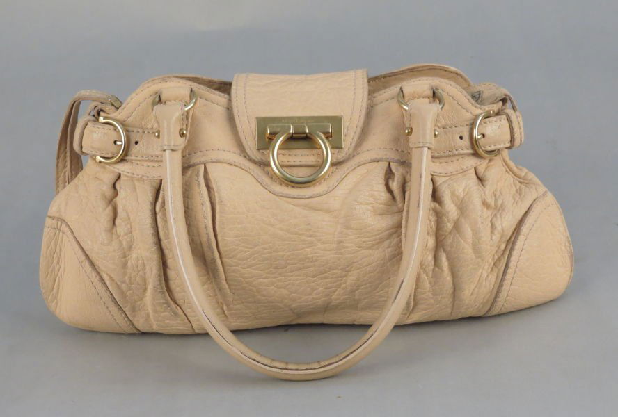 SALVATORE FERRAGAMO LEATHER HANDBAG.: SALVATORE FERRAGAMO LEATHER HANDBAG. Bearing a fold over flap with Ferragamo logo closure. Together with a Ferragamo dustbag 14.5" x 7"