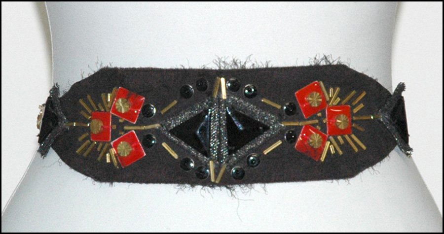 BILL BLASS TIE BELT.: BILL BLASS TIE BELT. Comprised of metal bugle beads, red enamel squares, black triangular beads, and round black enamel beads. With Bill Blass dustbag Length: 84"