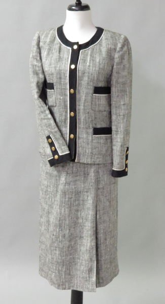 CHANEL BOUTIQUE SILK BLEND SKIRT SUIT.: CHANEL BOUTIQUE SILK BLEND SKIRT SUIT. Comprised of a jacket trimmed in black wool boucle with gold buttons and a pencil skirt Size label has been removed