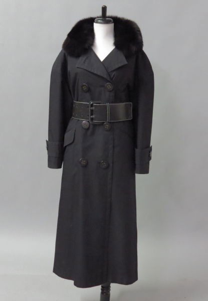 CHRISTIAN DIOR BLACK NYLON AND FUR COAT.: CHRISTIAN DIOR BLACK NYLON AND FUR COAT. Bearing a black fox fur collar. Interior is fully lined in rabbit fur. Together with a black nylon self belt, and a black leather belt Approzimately a size 8-1
