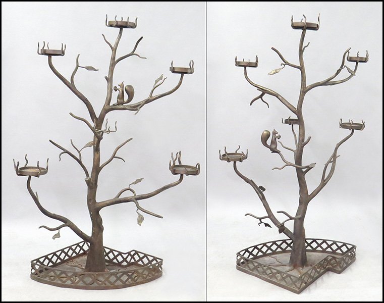 PAIR OF IRON PLANT STAND TREES.: PAIR OF IRON PLANT STAND TREES. Depicting squirrels within trees and bearing eleven inserts for plants H: 77'' W: 50'' D: 33''