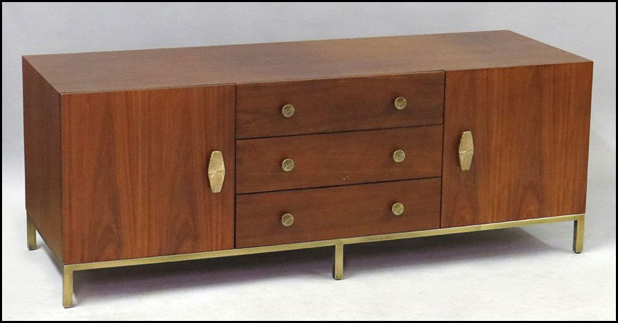 JONATHAN ADLER LOW CREDENZA.: JONATHAN ADLER LOW CREDENZA. Walnut veneer, raised on brass feet. Comprised of three central drawers, flanked by two cabinets H: 25" W: 66" D: 23"