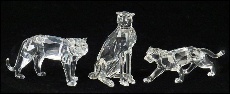 TWO SWAROVSKI CRYSTAL PANTHERS.: TWO SWAROVSKI CRYSTAL PANTHERS. Together with a Swarovski tiger. Includes tiger with original box. Tallest H: 4''