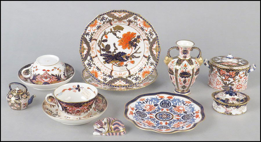 COLLECTION OF ROYAL CROWN DERBY IMARI PORCELAIN TABLE A: COLLECTION OF ROYAL CROWN DERBY IMARI PORCELAIN TABLE ARTICLES. Comprised of two 8.5'' diameter plates, two teacups, a tea caddy, a cat, a vase, a covered sugar, two 6.5'' diameter dishes, and a cabin