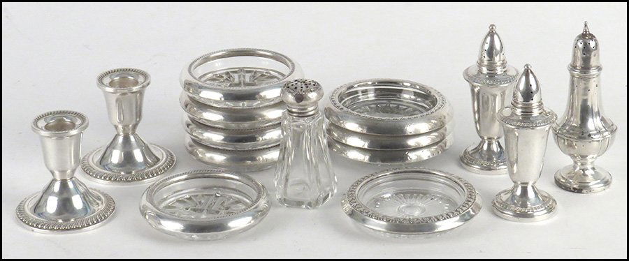 SET OF FIVE STERLING SILVER GLASS COASTERS.: SET OF FIVE STERLING SILVER GLASS COASTERS. Together with a pair of weighted sterling silver candlesticks, a pair of weighted sterling silver salt shakers, a set of four sterling silver glass coasters
