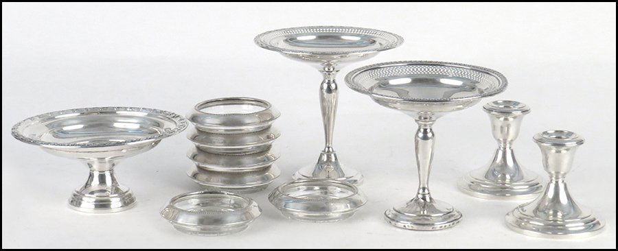 THREE WEIGHTED STERLING SILVER COMPOTES.: THREE WEIGHTED STERLING SILVER COMPOTES. Together with a pair of weighted sterling silver low candlesticks and a set of six sterling silver pressed glass coasters Compotes: Two at H: 5.5'' One at: 3''