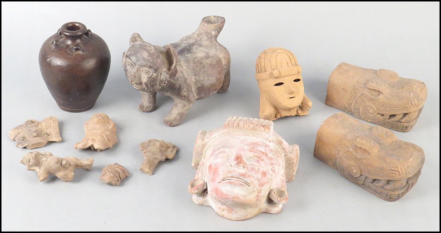 COLLECTION OF MEXICAN POTTERY.: COLLECTION OF MEXICAN POTTERY. Comprised of a Colima dog vessel, a jar, two warrior heads, a pair of bookends, a decorative shard pin, and four formed pottery chards
