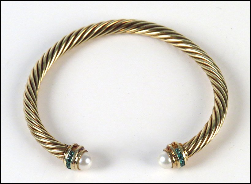 DAVID YURMAN 14 KARAT YELLOW GOLD CABLE TWIST CUFF BRAC: DAVID YURMAN 14 KARAT YELLOW GOLD CABLE TWIST CUFF BRACELET. Bearing emerald and pearl caps