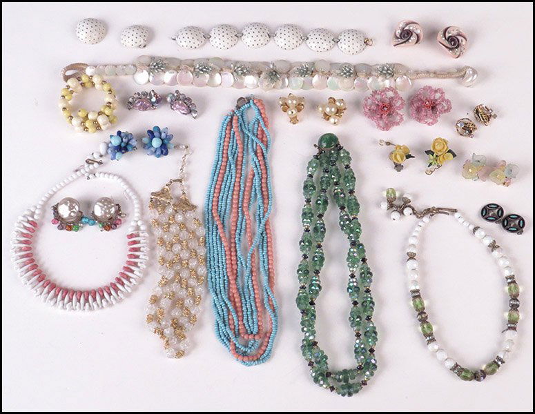 TRIFARI TRIPLE STRAND GOLD TONE AND GLASS NECKLACE.: TRIFARI TRIPLE STRAND GOLD TONE AND GLASS NECKLACE. Together with an enamel bracelet with coordinating earclips, a pair of Hattie Carnegie faux pearl earclips, and various necklaces, earclips, and bra