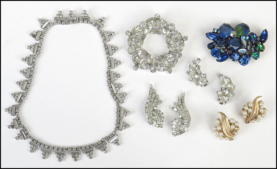 KRAMER WHITE RHINESTONE NECKLACE.: KRAMER WHITE RHINESTONE NECKLACE. Together with a Kramer white rhinestone brooch, a Kramer blue and green rhinestone brooch, two pairs of white rhinestone earclips, and a pair of Trifari faux pearl ea