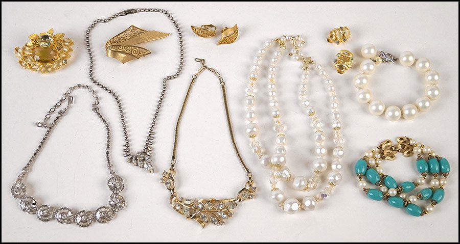 PENNINO WHITE RHINESTONE NECKLACE.: PENNINO WHITE RHINESTONE NECKLACE. Together with a Trifari white rhinestone necklace, a white rhinestone necklace, an unsigned brooch with matching earclips, a Trifari gold tone brooch with matching e