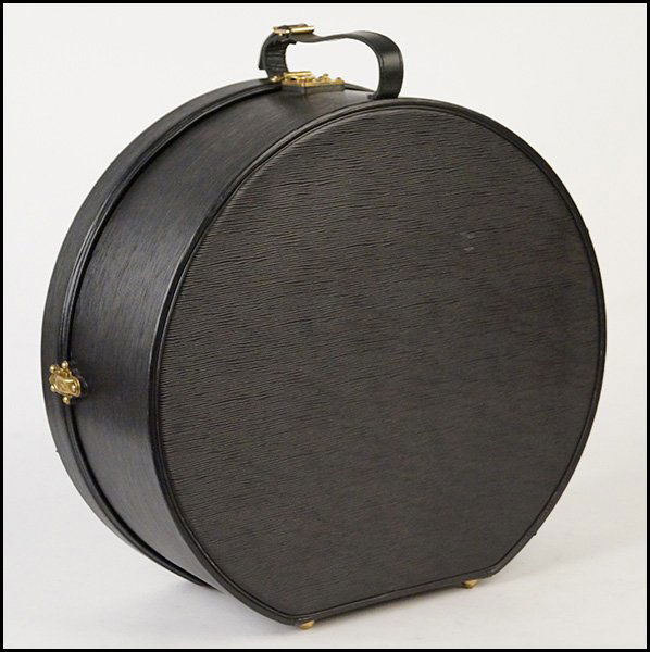 LOUIS VUITTON BLACK EPI LEATHER HAT BOX.: LOUIS VUITTON BLACK EPI LEATHER HAT BOX. With Louis Vuitton luggage tag Height: 8" Diameter: 19"