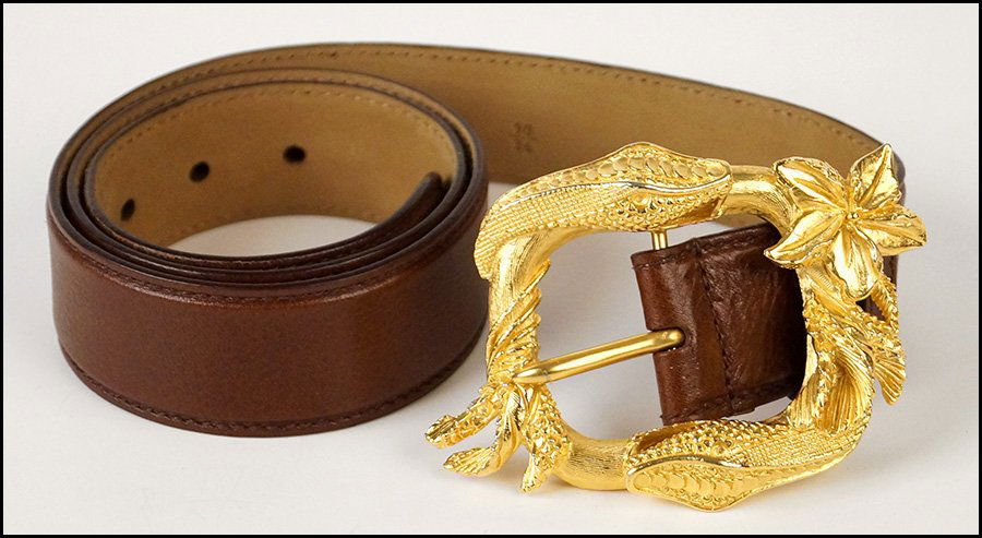 PRADA LEATHER AND GOLD TONE BELT.: PRADA LEATHER AND GOLD TONE BELT. Belt buckle depicts intertwined snakes Length: 36"