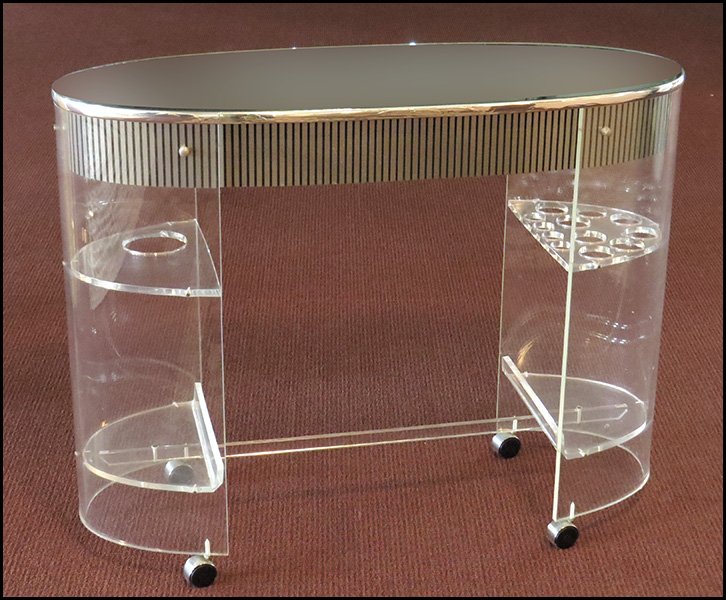 LUCITE BAR CART.: LUCITE BAR CART. Raised on castors with a mirror top H: 36" x W: 45" x D: 18"