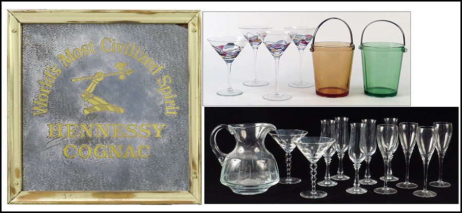 COLLECTION OF GLASS BAR ITEMS.: COLLECTION OF GLASS BAR ITEMS. Includes a pitcher, two ice buckets, martini glasses, a mirrored Henenessey plaque, and other various stemware items Pitcher height: 8.5"