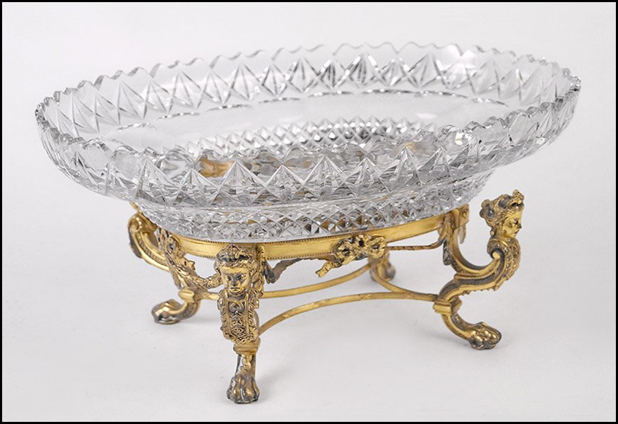 PAIRPOINT CRYSTAL CENTER BOWL.: PAIRPOINT CRYSTAL CENTER BOWL. Mounted on a lion paw gilt metal stand H: 7" x W: 14" x D: 11"