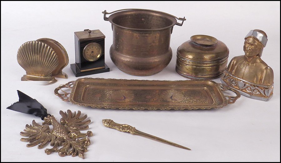 COLLECTION OF DESK ITEMS.: COLLECTION OF DESK ITEMS. Comprised of a metal armorial plaque, a brass letter opener, a metal box and tray, a desk clock, a pair of metal shell form bookends, a metal box, a copper spittoon, a metal 