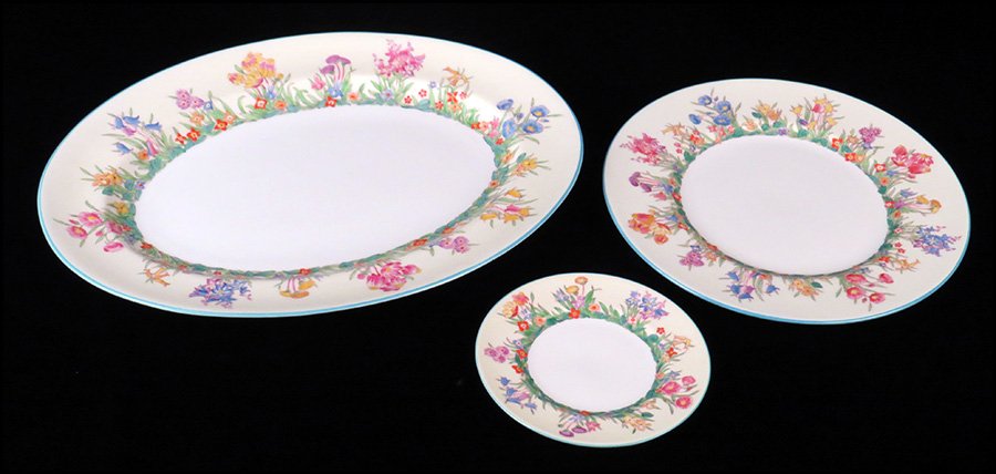 WEDGWOOD PORCELAIN PARTIAL DINNER SERVICE.: WEDGWOOD PORCELAIN PARTIAL DINNER SERVICE. In the Prairie Flowers pattern. Comprised of thirteen dinner plates, twelve bread plates, and a serving platter Serving platter: 12" x 16"