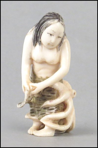 CARVED IVORY NETSUKE OF A MAIDEN AND OCTOPUS.: CARVED IVORY NETSUKE OF A MAIDEN AND OCTOPUS. Height: 2.25"
