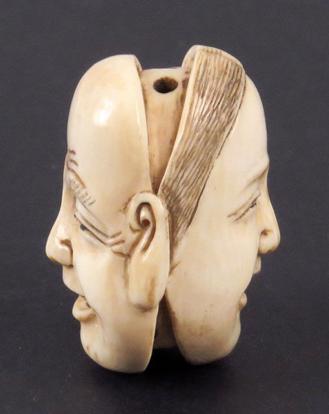CARVED IVORY NETSUKE OF MASKS.: CARVED IVORY NETSUKE OF MASKS.