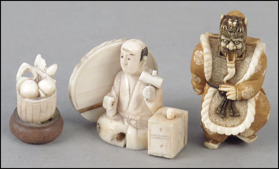 CARVED IVORY NETSUKE OF A WARRIOR.: CARVED IVORY NETSUKE OF A WARRIOR. Together with a carved ivory figure of a seated man and a carved ivory fruit basket Netsuke: 2.25" x 1"