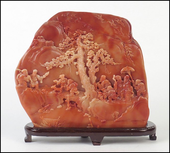 CHINESE CARVED SOAPSTONE SCHOLAR'S ROCK.: CHINESE CARVED SOAPSTONE SCHOLAR'S ROCK. Raised on a 1" wood base 9.5" x 11" x 2.5"