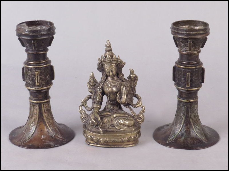 PAIR OF BRONZE ALTAR CANDLESTICKS.: PAIR OF BRONZE ALTAR CANDLESTICKS. Together with a metal deity figure Height: 7"