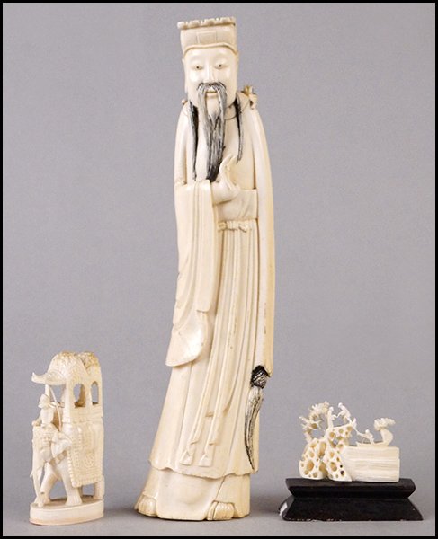 CARVED IVORY IMMORTAL FIGURE.: CARVED IVORY IMMORTAL FIGURE. Together with a carved bone scene and an Indian carved ivory elephant and riders Height: 9"