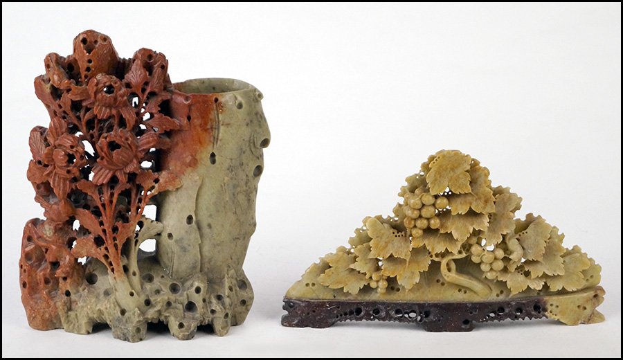TWO CHINESE CARVED SOAPSTONE FOLIATE FORMS.: TWO CHINESE CARVED SOAPSTONE FOLIATE FORMS. Comprised of a grapevine and a floral arrangement Tallest height: 9.5"