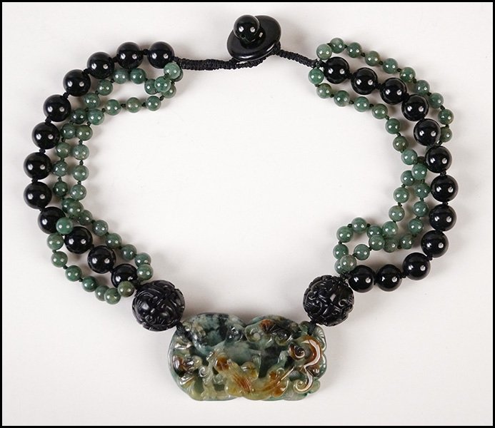 CHINESE TRIPLE-STRAND NECKLACE.