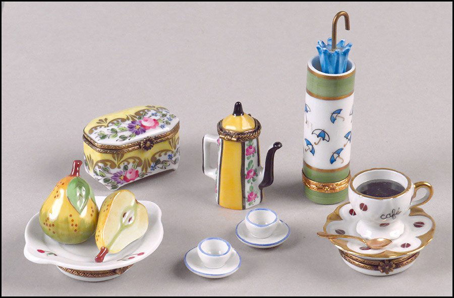 COLLECTION OF LIMOGES PORCELAIN BOXES.: COLLECTION OF LIMOGES PORCELAIN BOXES. Comprised of a coffee pot with two seperate teacups with saucers, a floral box, teacup and saucer, pears, and an umbrella stand