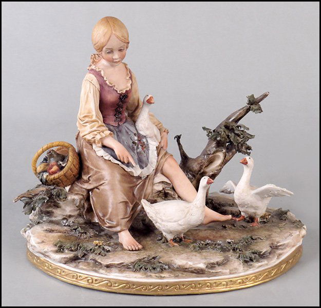 LUCIANO CAZZOLA CAPODIMONTE PAINTED BISQUE PORCELAIN FI: LUCIANO CAZZOLA CAPODIMONTE PAINTED BISQUE PORCELAIN FIGURAL GROUP. Depicting a maiden with geese against a tree H: 9" W: 11" D: 8"