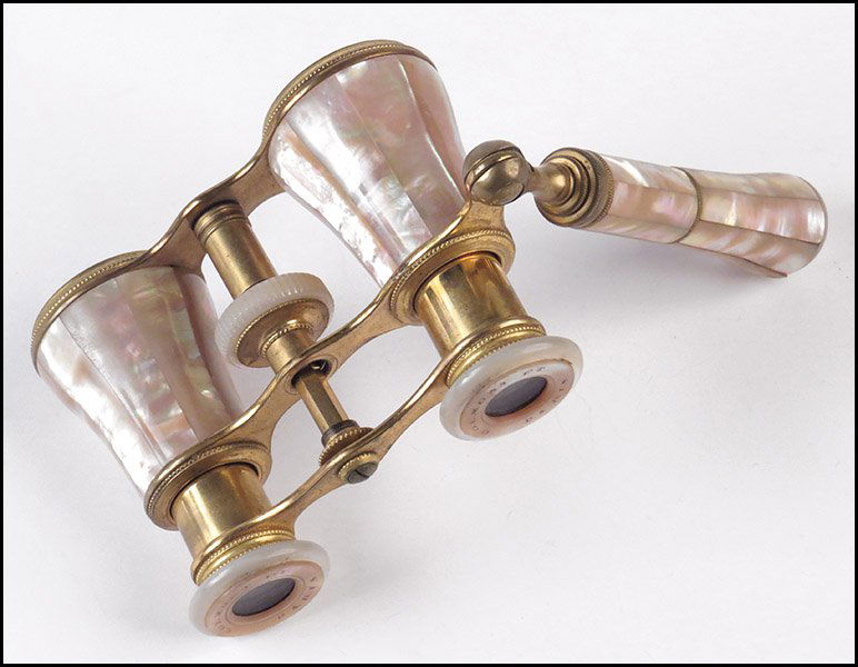 COLMONT FRERES PARIS GILT BRASS AND MOTHER OF PEARL STI: COLMONT FRERES PARIS GILT BRASS AND MOTHER OF PEARL STICK OPERA GLASSES. Glasses: 3'' x 4'' Stick L: 3.5''