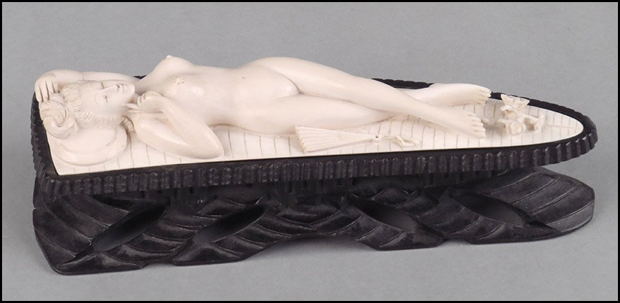 CARVED IVORY DOCTOR'S DOLL.: CARVED IVORY DOCTOR'S DOLL. Raised on separate 2" ebonized carved wood stand Width: 2.5" Length: 9"