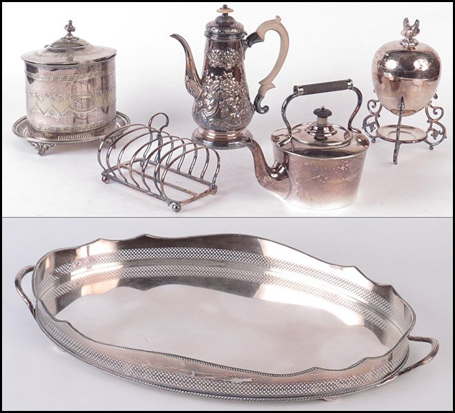 AN ASSEMBLED ENGLISH SILVERPLATE TEA SERVICE.: AN ASSEMBLED ENGLISH SILVERPLATE TEA SERVICE. Comprised of an egg warmer, a biscuit jar, a tea kettle, a toast rack, and a coffee pot on a handled filigree gallery silverplate tray Tray: 23'' x 17''