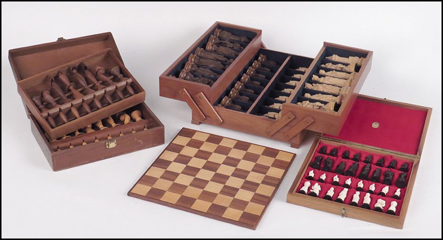 CARVED IVORY AND WOOD CHESS SET.: CARVED IVORY AND WOOD CHESS SET. Together with a hand carved Italian wood set of chess pieces and a set of modern carved wood chess pieces. Ivory and ebonized wood set comes in a velvet lined box with