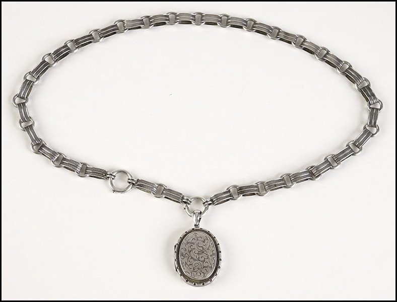 A VICTORIAN ENGLISH SILVER LINK NECKLACE AND LOCKET.: A VICTORIAN ENGLISH SILVER LINK NECKLACE AND LOCKET. Locket bears engraved decoration on both sides Length: 20.5"