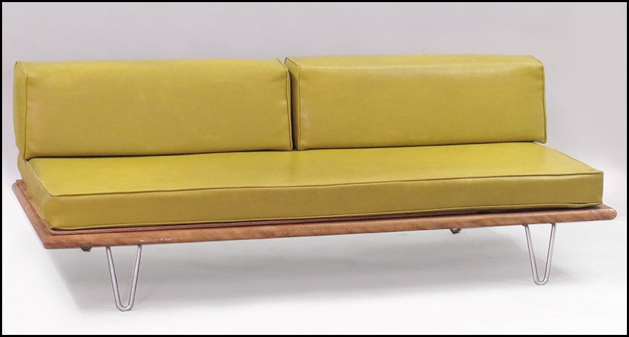 GEORGE NELSON FOR HERMAN MILLER WALNUT VENEER DAYBED.: GEORGE NELSON FOR HERMAN MILLER WALNUT VENEER DAYBED. With green vinyl upholstery, on metal hairpin legs 26.5'' x 73'' x 33''