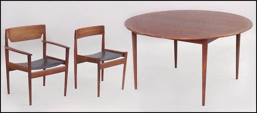 DANISH MODERN WALNUT DINING SUITE.: DANISH MODERN WALNUT DINING SUITE. Comprised of a table with two leaves (one leaf: 21.5'' wide), two armchairs (back H: 31'') and four side chairs (back H: 29'') with upholstered leather seats. By P. 