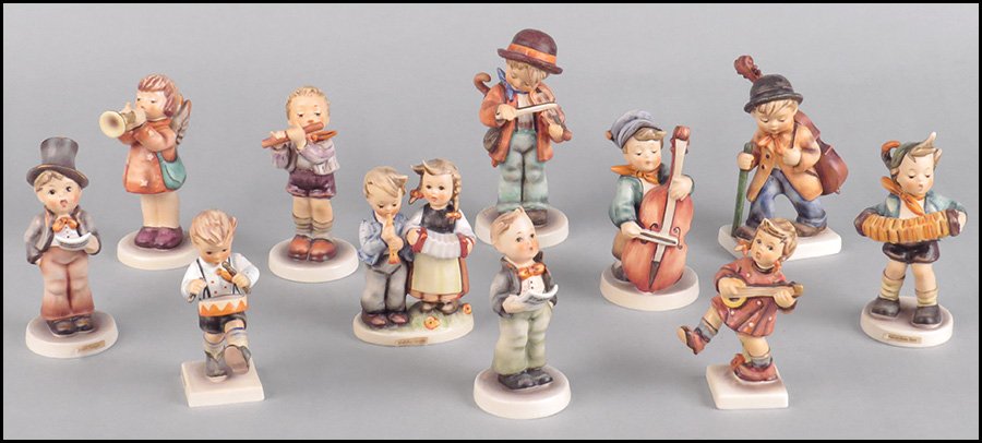 COLLECTION OF ELEVEN HUMMEL PORCELAIN FIGURES.: COLLECTION OF ELEVEN HUMMEL PORCELAIN FIGURES. All signed "M.I. Hummel." Comprised of "Sweet Music," "Accordion Boy," "Street Singer," a girl playing banjo, "Little Drummer," "Little Fiddler," a boy w