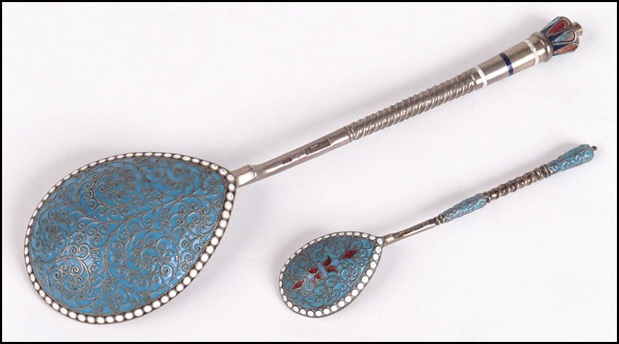 RUSSIAN GILT SILVER AND CHAMPLEVE ENAMEL SERVING SPOON.: RUSSIAN GILT SILVER AND CHAMPLEVE ENAMEL SERVING SPOON. Together with a Russian gilt silver and champleve enamel spoon (length: 4.5") Serving spoon: 7.5"