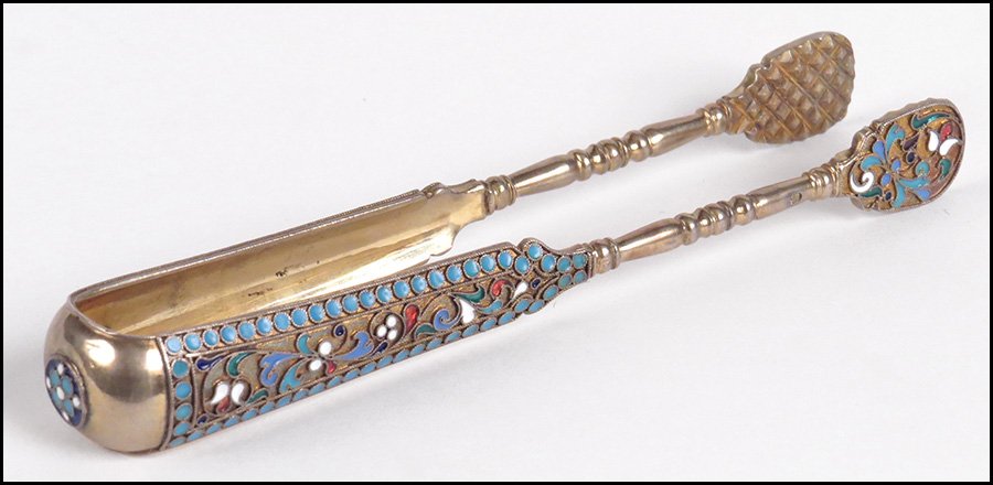 PAIR OF RUSSIAN GILT SILVER SUGAR TONGS.: PAIR OF RUSSIAN GILT SILVER SUGAR TONGS. Bearing champleve enamel decoration Length: 5.25"