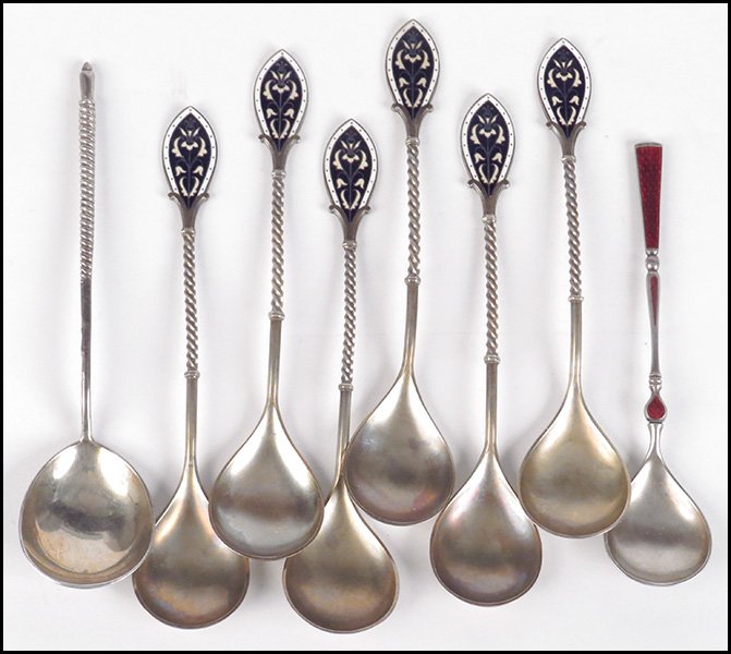 RUSSIAN GILT SILVER SPOON.: RUSSIAN GILT SILVER SPOON. Reverse of bowl bears engraved decoration. Handled is formed by a twisted design. Together with a set of six enamel handled spoons, and a red guilloche enamel spoon