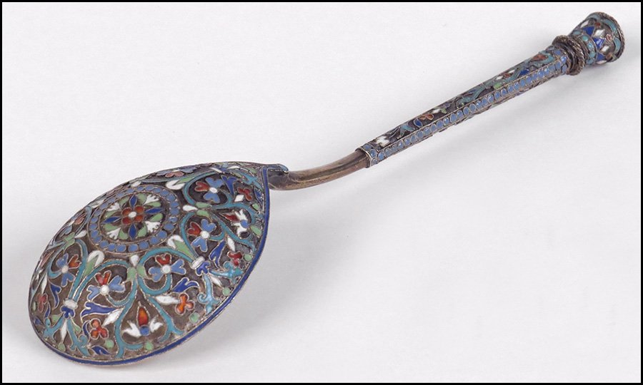 RUSSIAN GILT SILVER SERVING SPOON.: RUSSIAN GILT SILVER SERVING SPOON. Bearing champleve enamel decoration Length: 7.75"