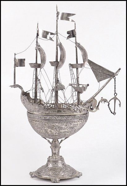 SILVERPLATE MODEL NEFF / SHIP.: SILVERPLATE MODEL NEFF / SHIP. Raised on a double fish form base. Cover lifts off to reveal a goldwashed interior Height: 17"